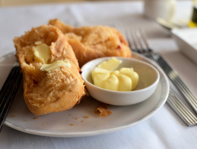 Crusty fresh bread rolls and butter on Singapore Airlines