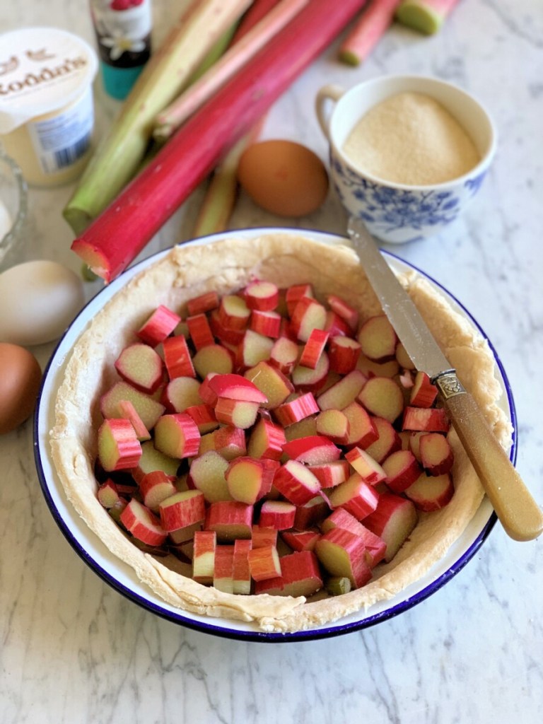 Pre-heat oven to 200C/400F/Gas mark 6. Grease a 23cm (9") pie dish and line it with shortcrust pastry. I used 320g (12ozs) of homemade shortcrust pastry, but you can also use a ready-made unbaked pie shell as sold in the supermarkets, or use ready-rolled shortcrust pastry. Arrange the rhubarb pieces in the unbaked pie shell, or shortcrust pastry pie crust.