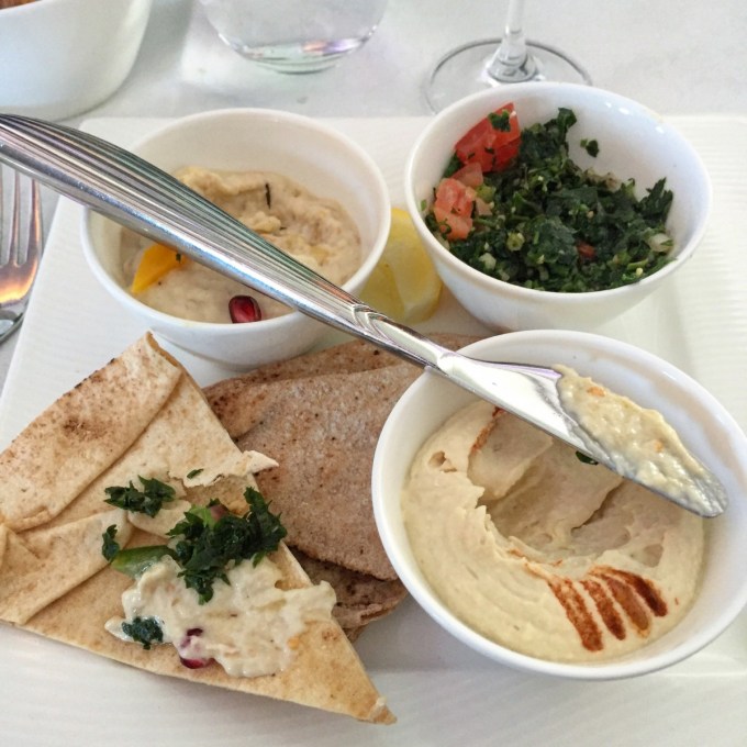 Classic Arabic mezze hummus, tabouleh, muhammara and lahim bil agine served with arabic bread