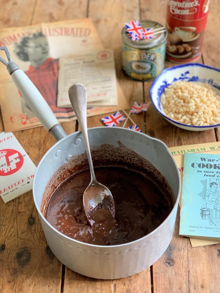 Melt the butter in a pan with the golden syrup, then add the cocoa powder and mix well, stirring all the time.