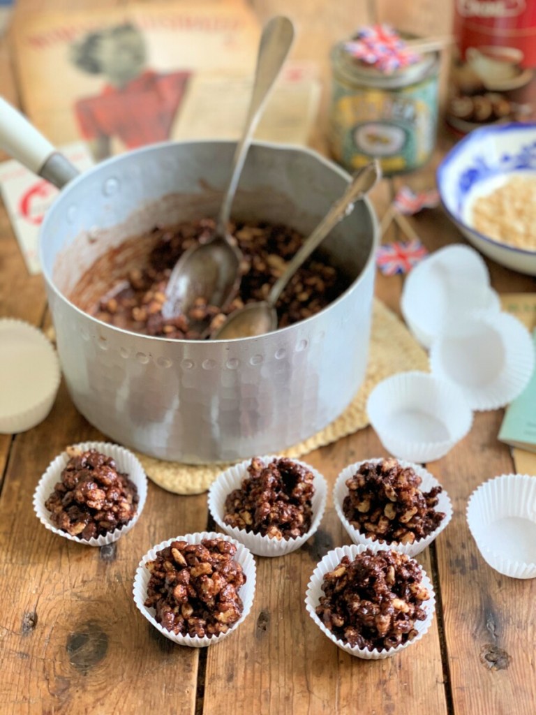 Turn the heat down to the lowest temperature and add the rice krispies or cereal gradually, mixing all the time until there is no "spare" chocolate covering left and that are well coated.