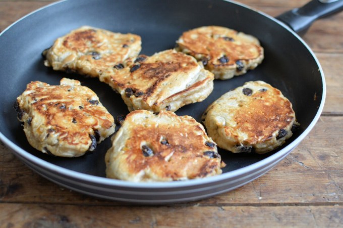 Heat a large non-stick frying pan or a griddle, and grease it with butter.
Cook 2 or 3 hotcakes at a time by dropping spoonfuls of the mixture on to the hot, greased griddle or frying pan.